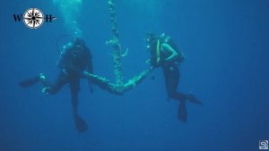 Scuba Divers Learning The Skill Of Wreck Hunting